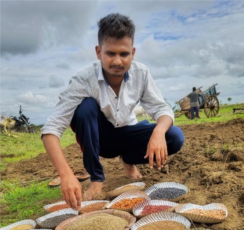 Siddhesh checking the seeds during the sowing season 